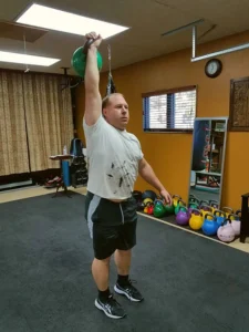 Client performing kettlebell lift